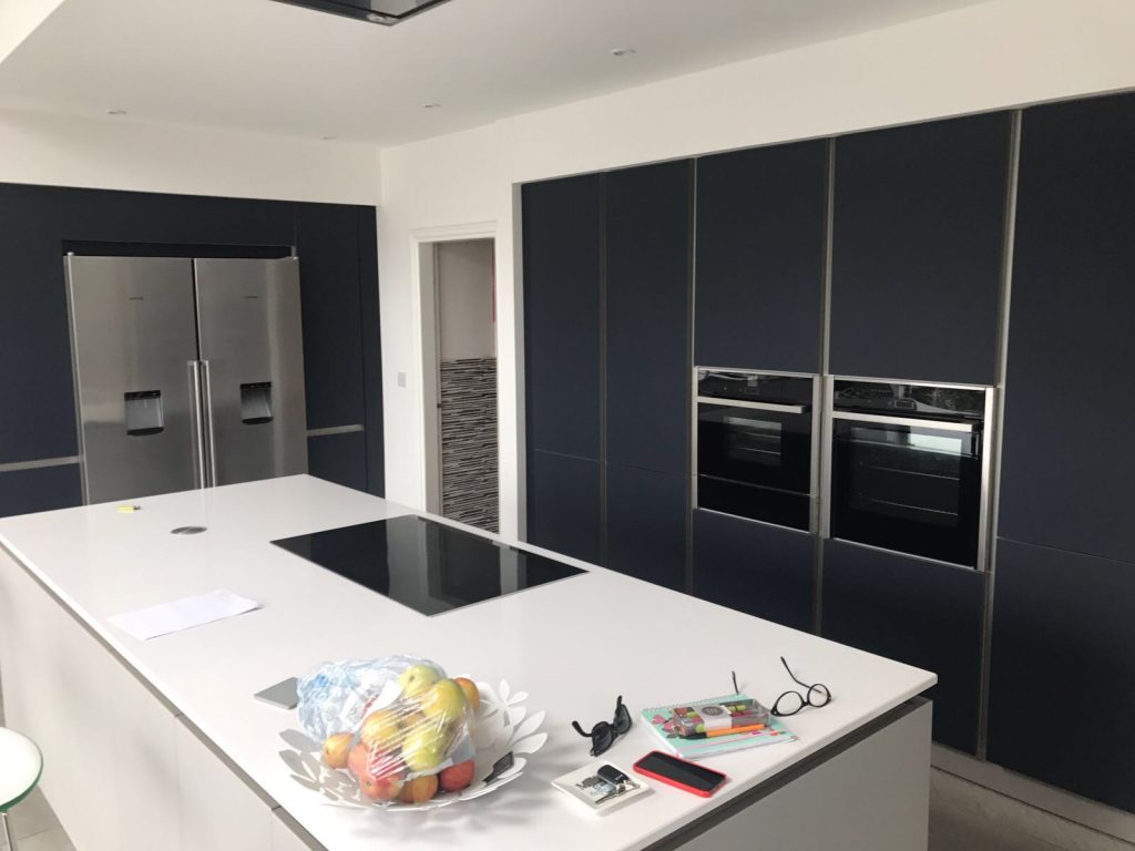 Schuller Next 125 Glassline German kitchen in NX902 Indigo Blue